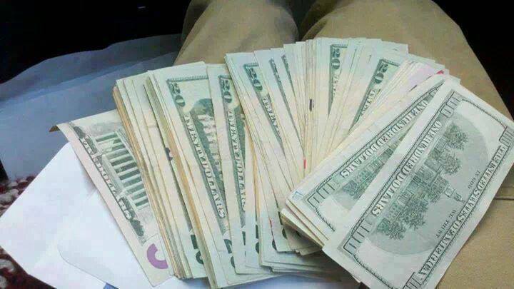 A man holding his savings in the lap thinking how to invest it for his retirement income | Outlook Wealth Advisors